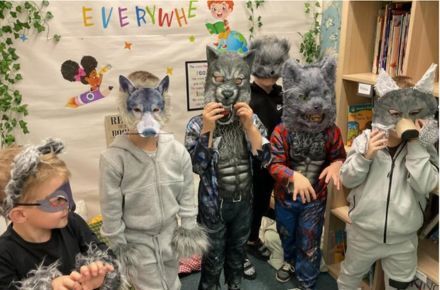 32 Y1 Fairytale day. Pupils wearing wolf masks.
