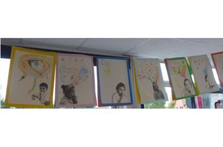 Y4 PSHCE. Hanging artwork with pupil images.