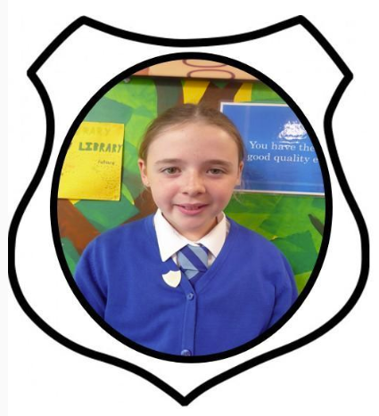 Picture of a girl in a blue school uniform   head girl