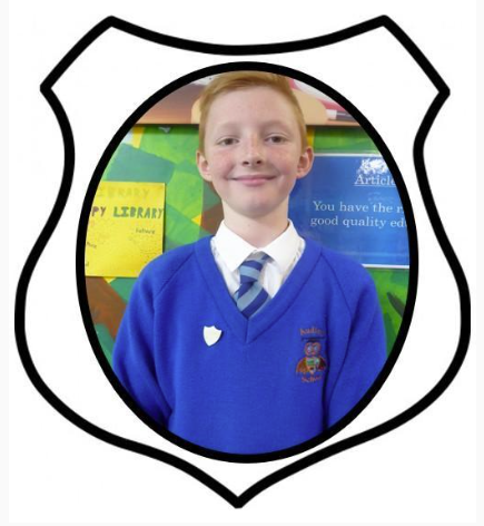 Head Boy. A picture of a primary aged boy in a blue school uniform