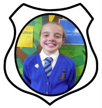 Deputy Head Girl. A picture of a girl smiling in blue school uniform