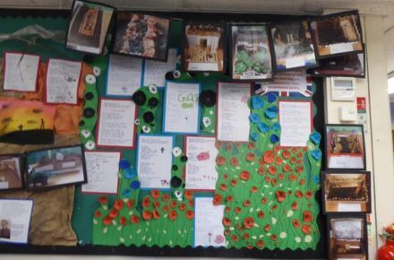 Y6 WW2. Green poster with red poppies.
