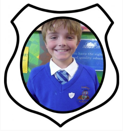 Deputy Head Boy. A picture of a boy smiling in blue school uniform