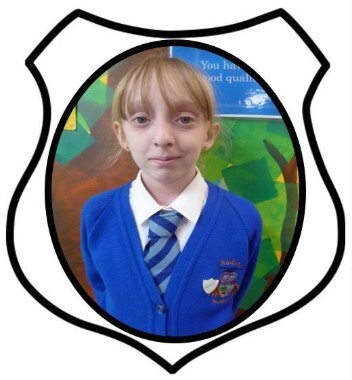 Year 6 Prefect. A picture of a girl smiling in blue school uniform