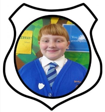 Year 6 Prefect. A picture of a girl smiling in blue school uniform