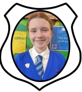 Year 6 Prefect. A picture of a girl smiling in blue school uniform