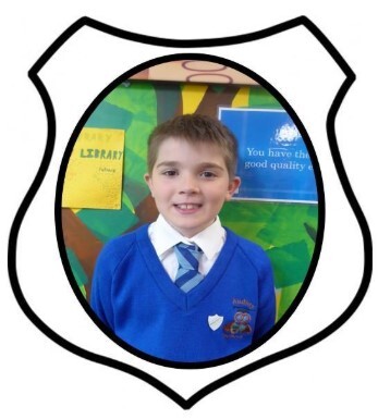 Year 6 Prefect. A picture of a boy smiling in blue school uniform
