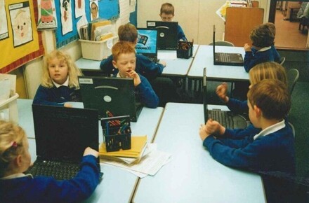 Dell Laptops 2002. Pupils working on laptops in classroom.