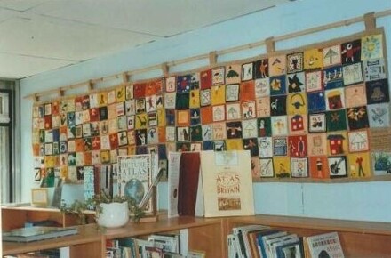 DT Tapestry for the KS2 Library 1997. Tapestry shown on library wall.