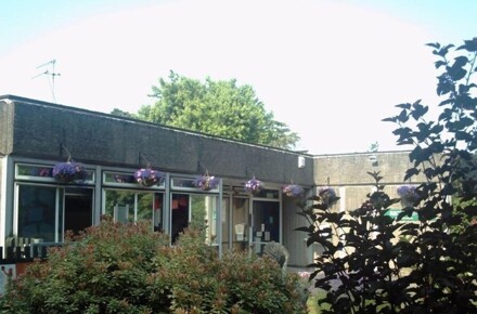 Front of school 2007. Building and trees.