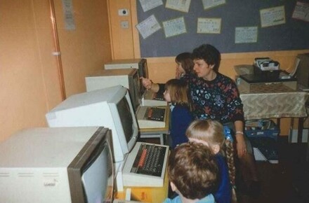YR Working at the Computers 1997. Pupils and teacher shown at computers.