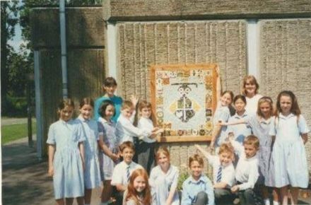 DT Mosaic, whole school project 1996 1997. Pupils in front of mosaic outside.
