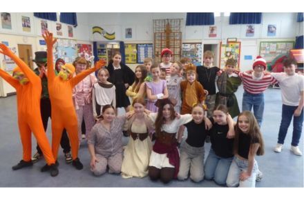 11 World Book Day. Pupil group dressed up as characters.
