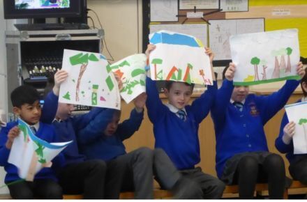 16 Y3 Fine Class Assembly. Pupils in blue uniform holding pictures.
