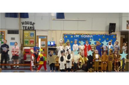 24 YR Nativity. Pupils in nativity scene on stage.