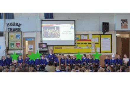 26 Y2 Browne Class Assmebly. Children on stage presenting.